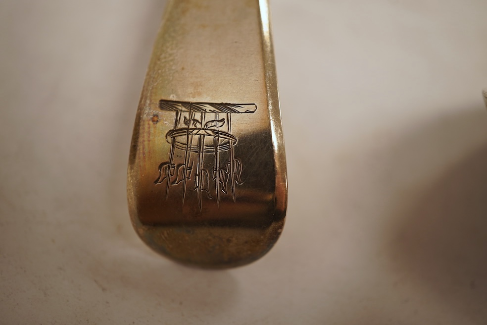 A George III silver fiddle pattern stilton scoop, John Lias, London, 1816, 20cm, together with two Georgian silver sauce ladles, a similar sifter ladle and a William IV shell pattern fish knife, 8.9oz.